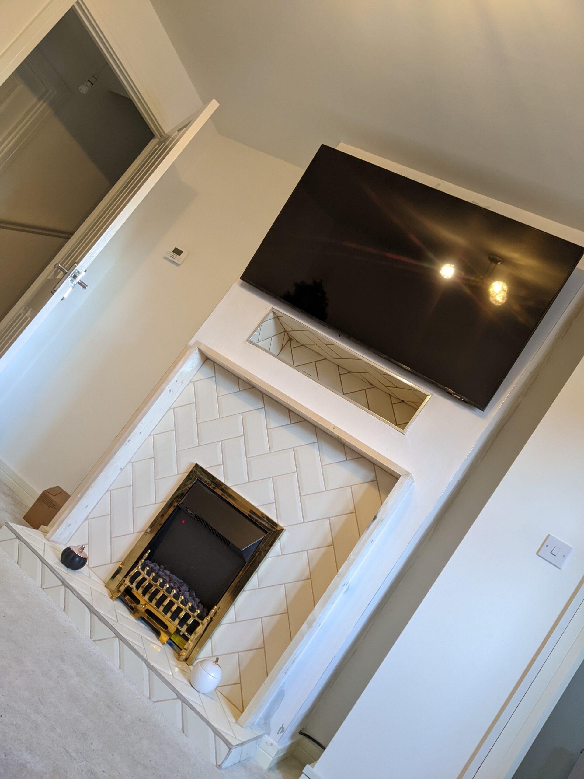 Install fireplace / TV wall